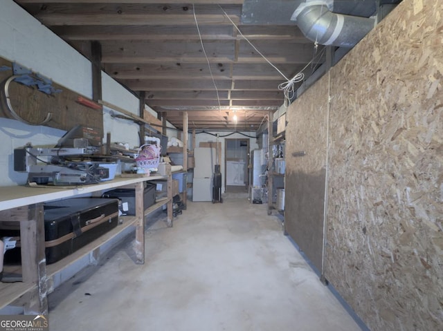 basement featuring white fridge