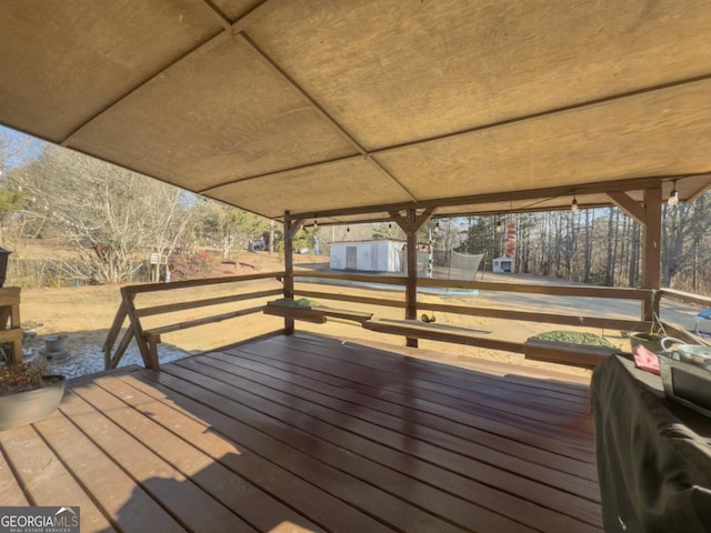 wooden deck featuring a trampoline