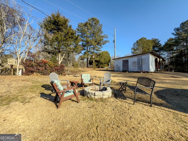 view of yard featuring a fire pit