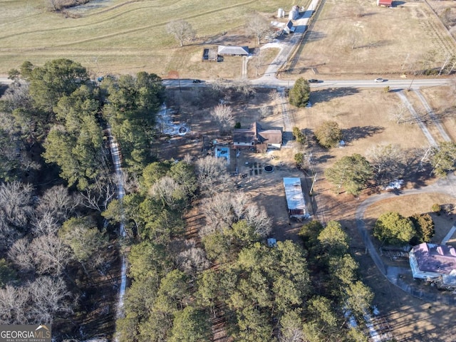 birds eye view of property with a rural view