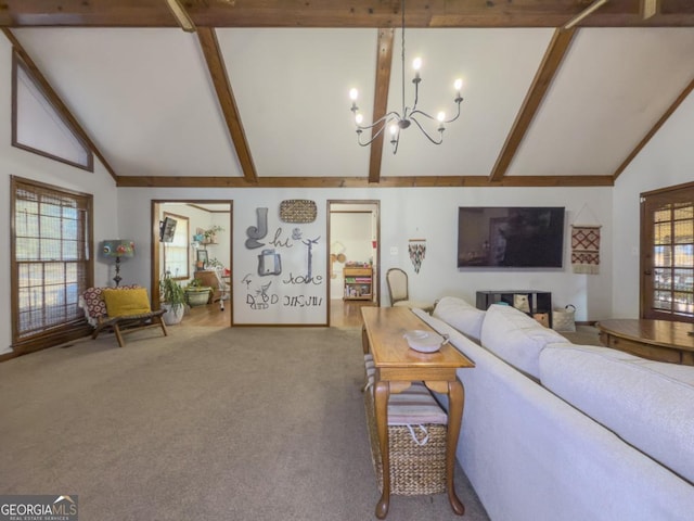 carpeted living room with an inviting chandelier, beam ceiling, and high vaulted ceiling