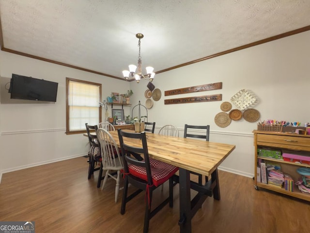 dining area with dark hardwood / wood-style flooring, a chandelier, and a textured ceiling