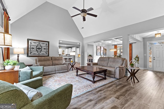 45 Misty Creek Cv, Newnan, GA 30265 - kitchen featuring appliances with stainless steel finishes, a sink, white cabinets, tasteful backsplash, and light wood-style floors