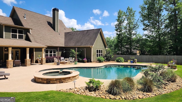 45 Misty Creek Cv, Newnan, GA 30265 - view of pool with a patio area, a fenced backyard, and a pool with connected hot tub