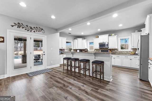 45 Misty Creek Cv, Newnan, GA 30265 - bedroom with high vaulted ceiling, wood finished floors, and ceiling fan