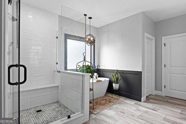 45 Misty Creek Cv, Newnan, GA 30265 - full bath featuring double vanity, ensuite bathroom, a chandelier, and baseboards