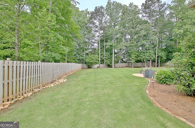 45 Misty Creek Cv, Newnan, GA 30265 - view of patio with fence and an outdoor fire pit