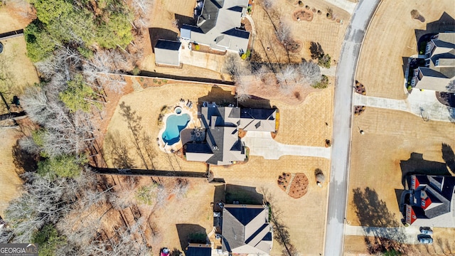 45 Misty Creek Cv, Newnan, GA 30265 - view of front of property with driveway, board and batten siding, a garage, and roof with shingles