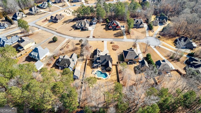 45 Misty Creek Cv, Newnan, GA 30265 - view of front facade featuring concrete driveway, a garage, a front yard, a shingled roof, and board and batten siding