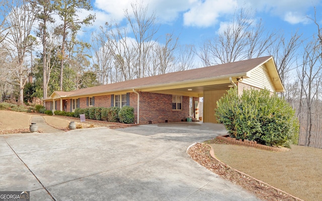 ranch-style house featuring a carport