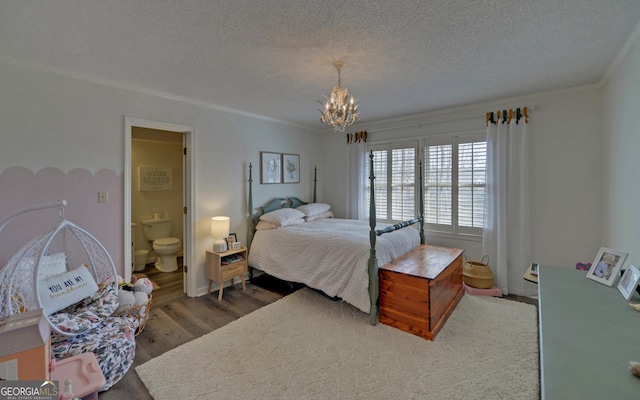 bedroom featuring ensuite bath, hardwood / wood-style flooring, ornamental molding, a textured ceiling, and a chandelier