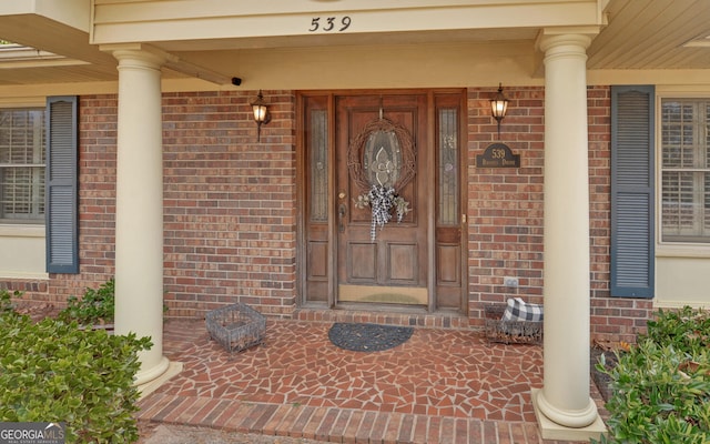 property entrance featuring covered porch