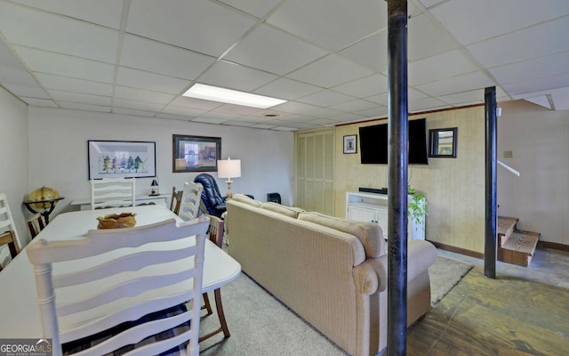 living room featuring a drop ceiling