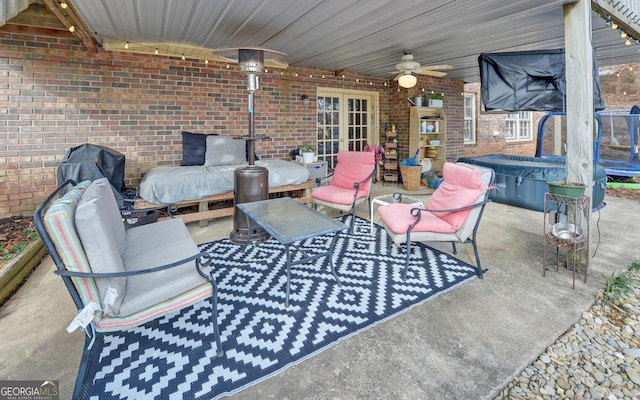 view of patio / terrace featuring ceiling fan and outdoor lounge area