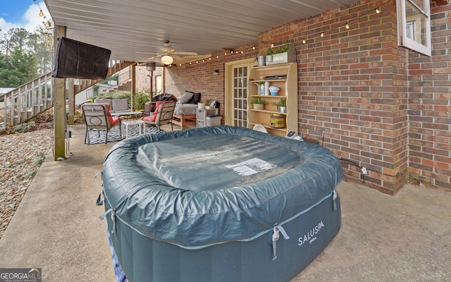 view of patio featuring outdoor lounge area and ceiling fan