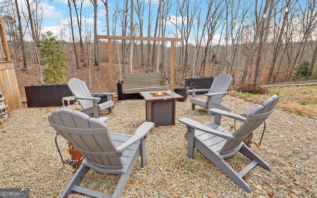 view of patio / terrace featuring an outdoor fire pit