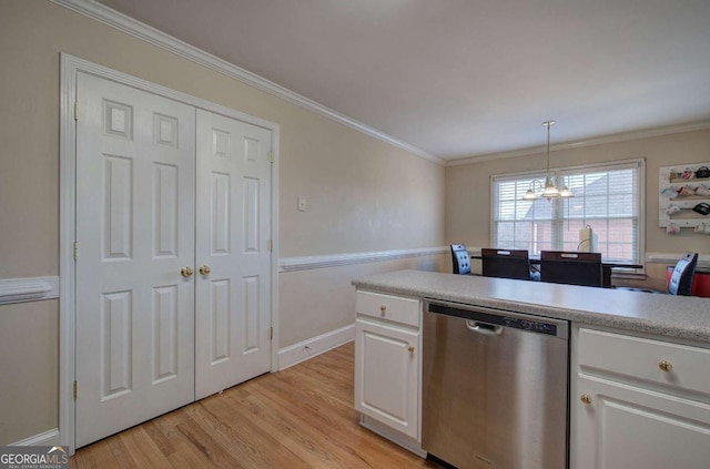 kitchen featuring pendant lighting, ornamental molding, dishwasher, and white cabinets