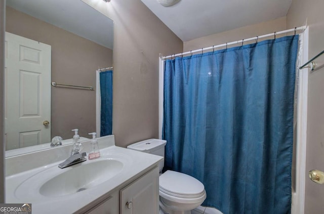 bathroom with vanity, a shower with curtain, and toilet