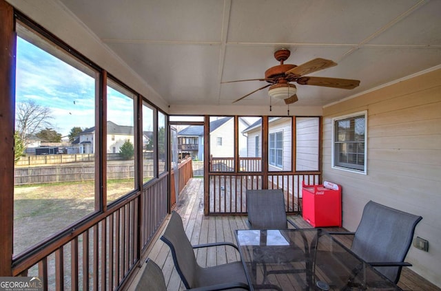 sunroom / solarium with plenty of natural light and ceiling fan