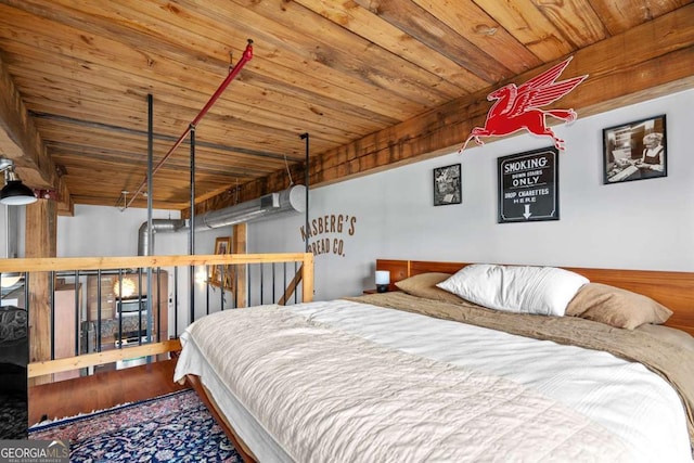 bedroom featuring hardwood / wood-style flooring and wood ceiling