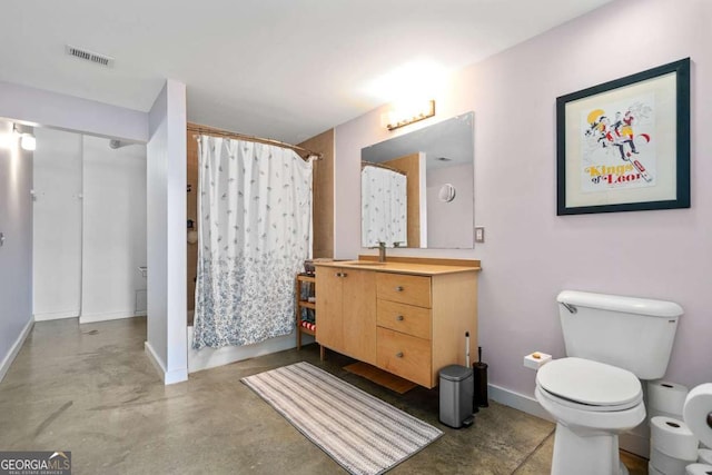 bathroom with vanity, toilet, curtained shower, and concrete floors