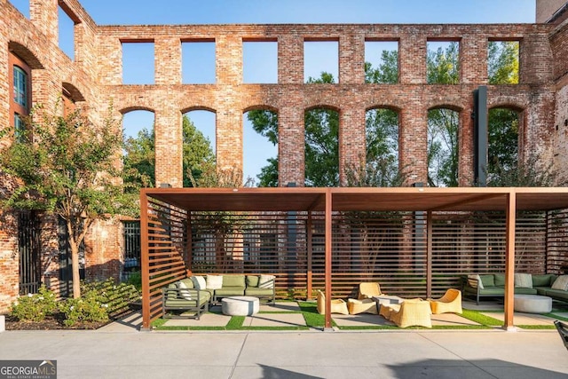 exterior space with outdoor lounge area, a pergola, and a patio