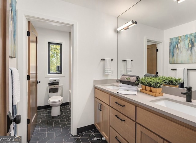 bathroom with tile patterned floors, toilet, and vanity