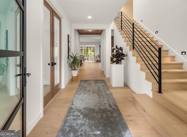 foyer with french doors and light wood-type flooring