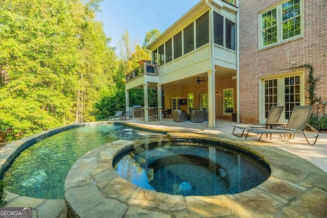 view of pool with an in ground hot tub, ceiling fan, a patio area, and french doors