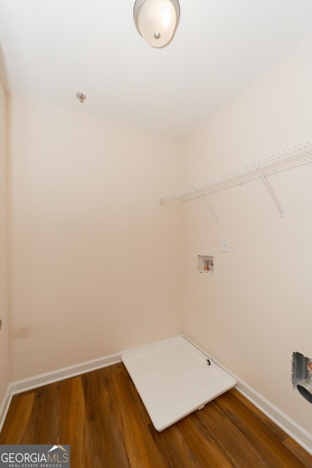 laundry room with hookup for a washing machine and wood-type flooring