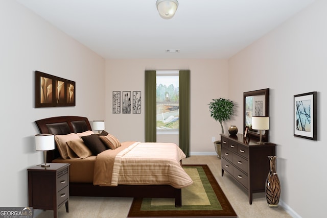 bedroom with light carpet, visible vents, and baseboards