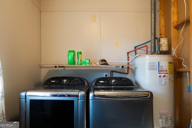 laundry room featuring washer and clothes dryer and water heater