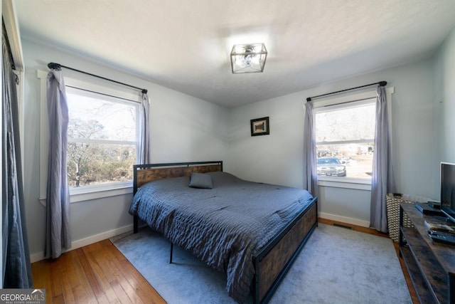 bedroom with light wood-type flooring