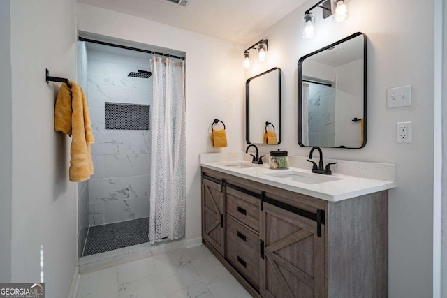 bathroom featuring vanity and curtained shower