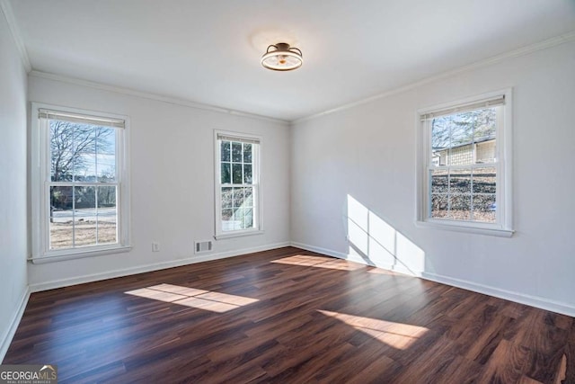 spare room with crown molding and dark wood-type flooring