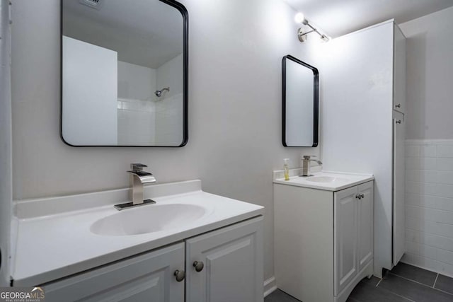 bathroom with vanity and tile patterned floors