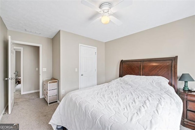 carpeted bedroom featuring ceiling fan