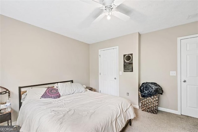 bedroom with light colored carpet and ceiling fan