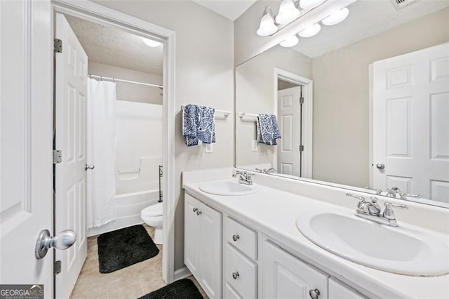 full bathroom featuring shower / tub combo with curtain, tile patterned floors, toilet, and vanity