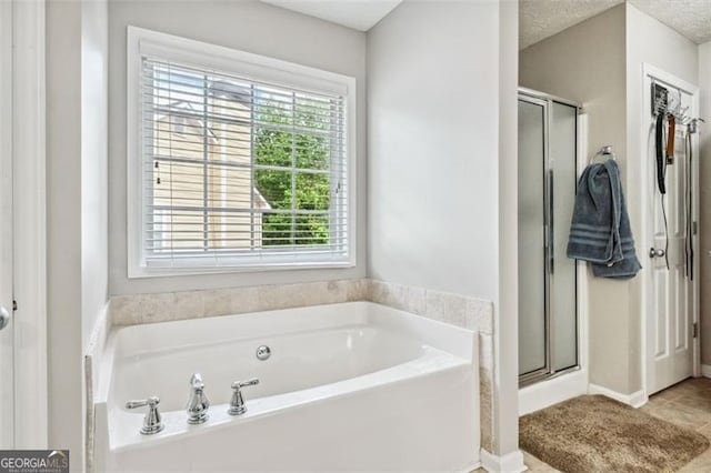 bathroom featuring plus walk in shower