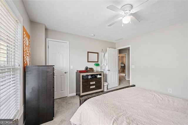 carpeted bedroom featuring ceiling fan