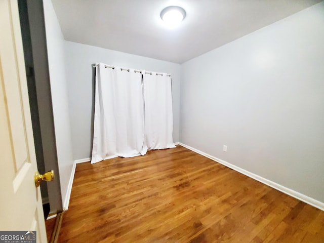 unfurnished bedroom featuring wood-type flooring