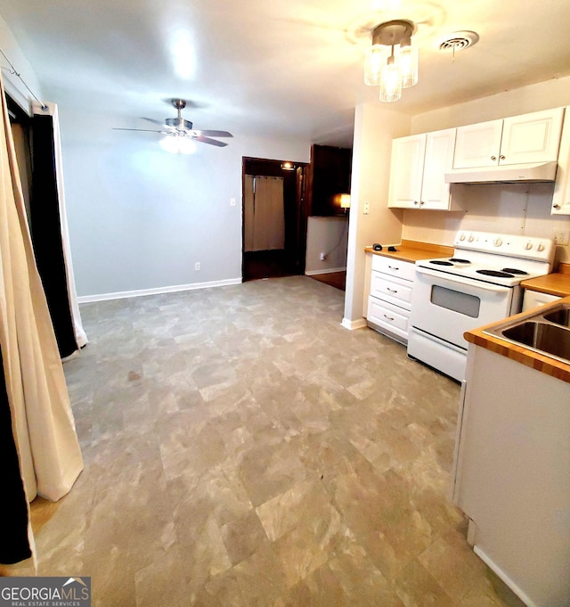 kitchen with white cabinetry, sink, electric range, and ceiling fan