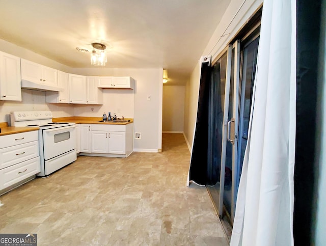 kitchen featuring sink, white cabinets, and white range with electric cooktop