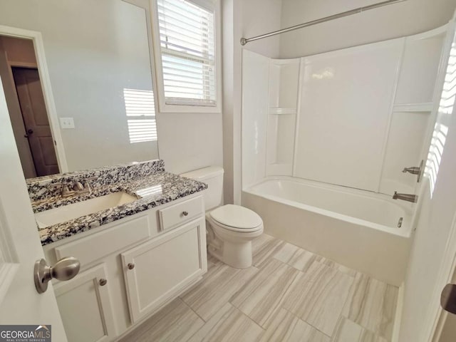 full bathroom with vanity, shower / bathtub combination, and toilet