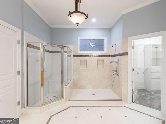 bathroom with crown molding, tile patterned floors, and a shower with shower door