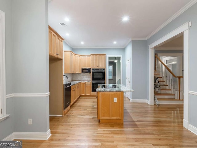 kitchen with light brown cabinetry, light stone counters, black appliances, a kitchen island, and backsplash