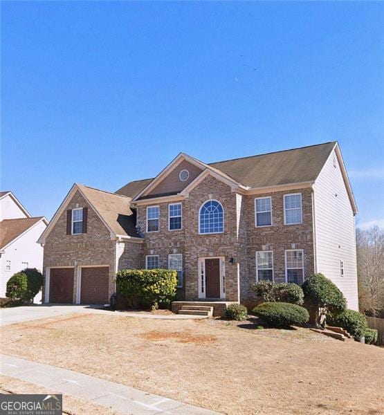 colonial home with a garage