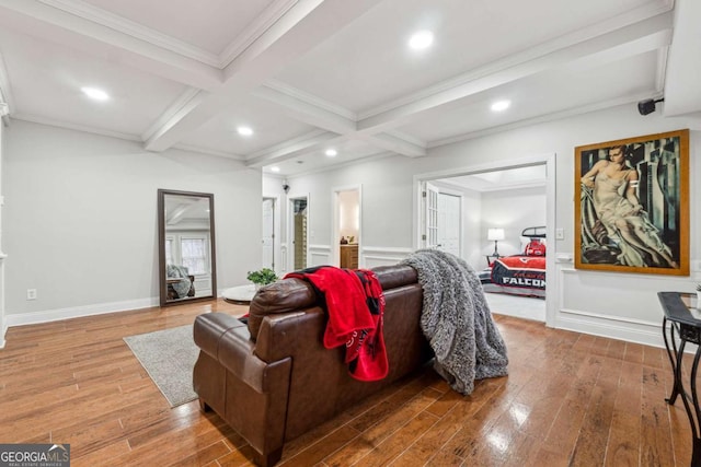 living room with beamed ceiling, ornamental molding, coffered ceiling, and hardwood / wood-style floors