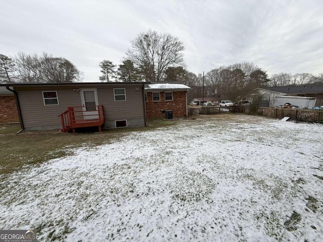 view of snow covered house